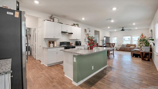 Dining room, Interior, Kitchen, Living room, Recessed Lighting, Stainless Steel Appliances, Wood Texture Flooring