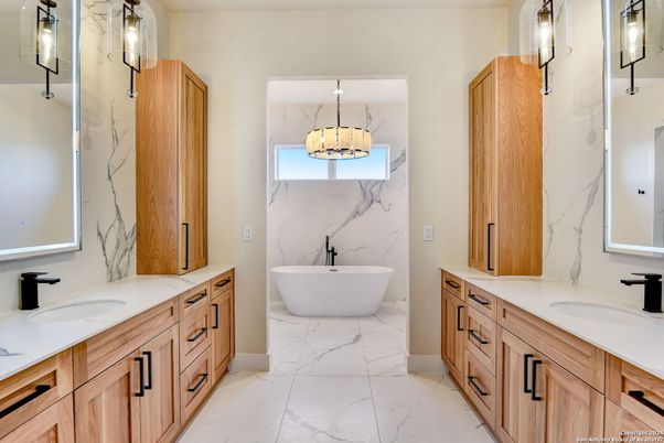 Bathroom, Dual Sink Vanities, Free Standing Baths, Interior, Marble, Marble Walls, Pendant Lights