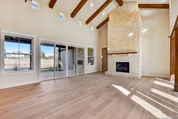 Empty room, Fireplace, Interior, Recessed Lighting, Wooden Beams, Wood Texture Flooring