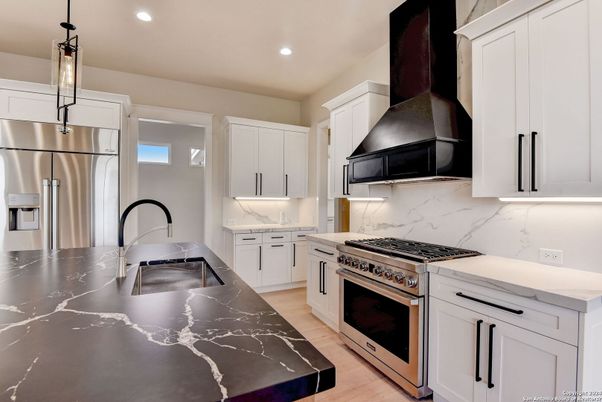 Interior, Kitchen, Marble Walls, Recessed Lighting, Stainless Steel Appliances, Wood Texture Flooring