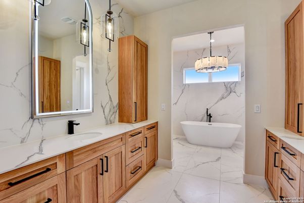 Bathroom, Dual Sink Vanities, Free Standing Baths, Interior, Marble, Marble Walls, Pendant Lights