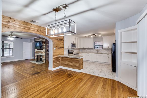 Fireplace, Interior, Kitchen, Pendant Lights, Wood Texture Flooring, Wooden Walls