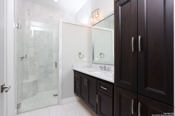 Bathroom, Dual Sink Vanities, Glass Shower, Interior, Marble Walls, Recessed Lighting