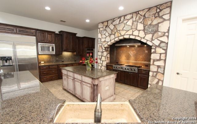 Interior, Kitchen, Recessed Lighting, Stainless Steel Appliances, Stone Walls
