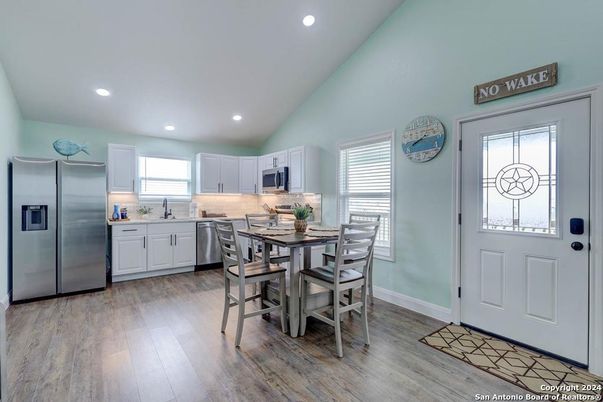 Dining room, Interior, Kitchen, Recessed Lighting, Stainless Steel Appliances, Wood Texture Flooring