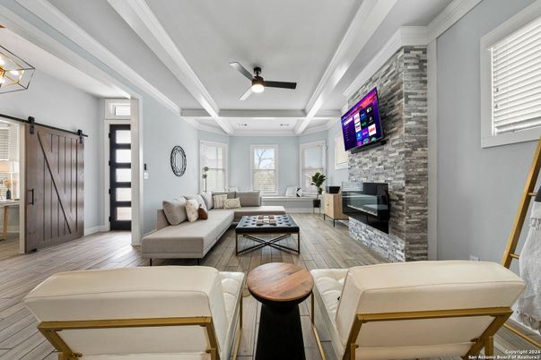 Fireplace, Interior, Living room, Recessed Lighting, Stone Walls, Wood Texture Flooring