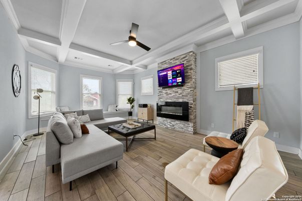 Fireplace, Interior, Living room, Recessed Lighting, Stone Walls, Wood Texture Flooring