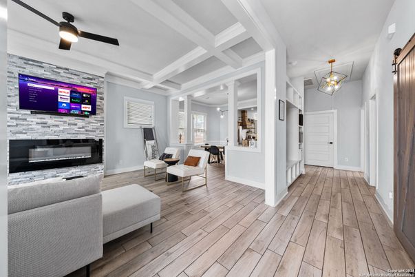 Fireplace, Interior, Living room, Pendant Lights, Recessed Lighting, Stone Walls, Wood Texture Flooring