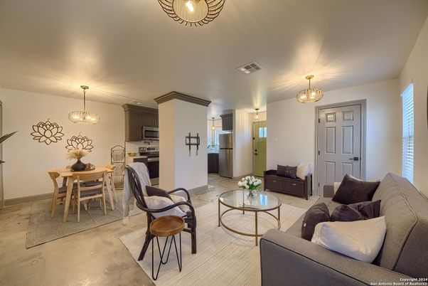 Chandelier, Dining room, Interior, Kitchen, Living room, Pendant Lights, Stainless Steel Appliances, Wood Texture Flooring
