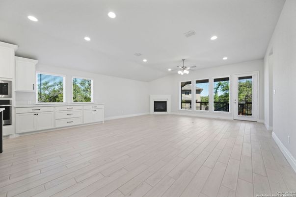 Empty room, Fireplace, Interior, Kitchen, Recessed Lighting, Wood Texture Flooring