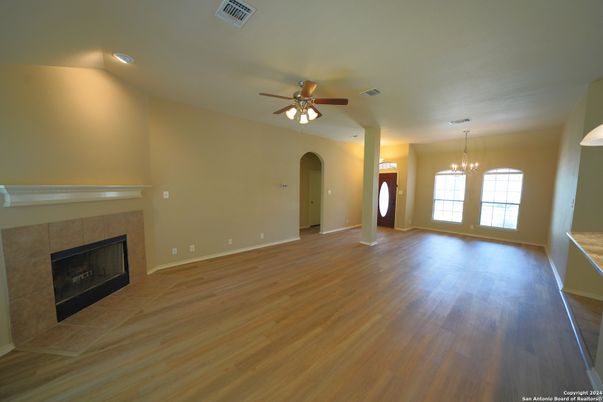 Chandelier, Empty room, Fireplace, Interior, Pendant Lights, Recessed Lighting, Wood Texture Flooring