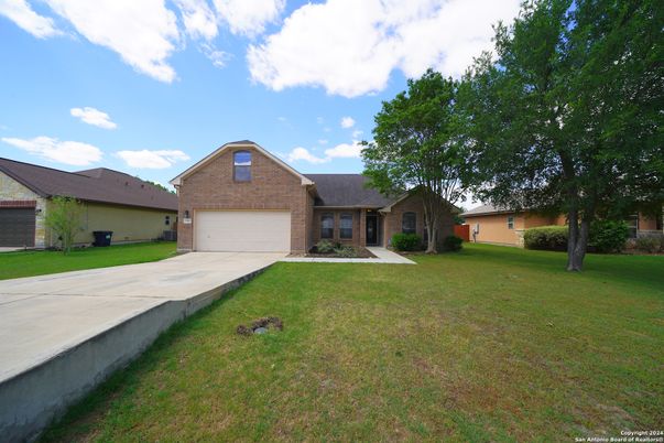 Attached, Backyard, Exterior, Facade, Brick Facade, Ranch