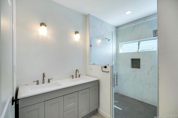 Bathroom, Dual Sink Vanities, Glass Shower, Interior, Marble Walls, Recessed Lighting