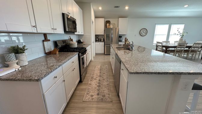 Dining room, Interior, Kitchen, Recessed Lighting, Stainless Steel Appliances, Wood Texture Flooring