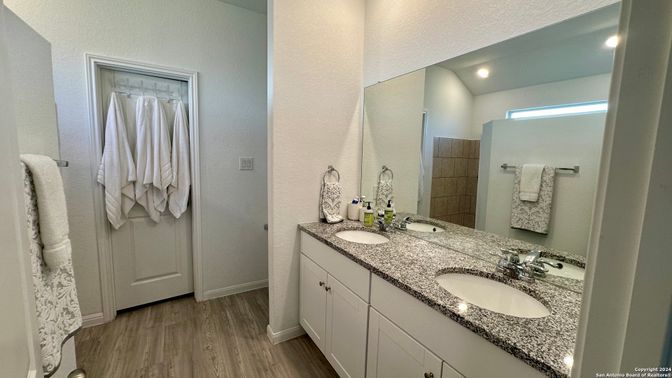 Bathroom, Dual Sink Vanities, Interior, Recessed Lighting, Wood Texture Flooring
