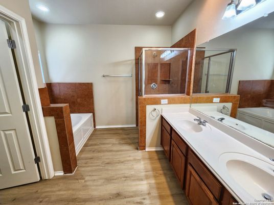 Bathroom, Dual Sink Vanities, Glass Shower, Interior, Recessed Lighting, Wood Texture Flooring