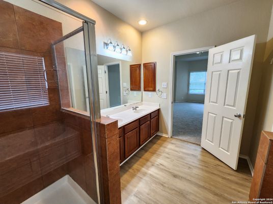 Bathroom, Dual Sink Vanities, Interior, Recessed Lighting, Wood Texture Flooring