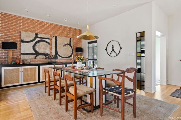 Dining room, Fireplace, Interior, Pendant Lights, Recessed Lighting, Stone Walls, Wood Texture Flooring