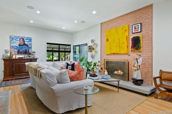 Fireplace, Interior, Living room, Recessed Lighting, Stone Walls, Wood Texture Flooring