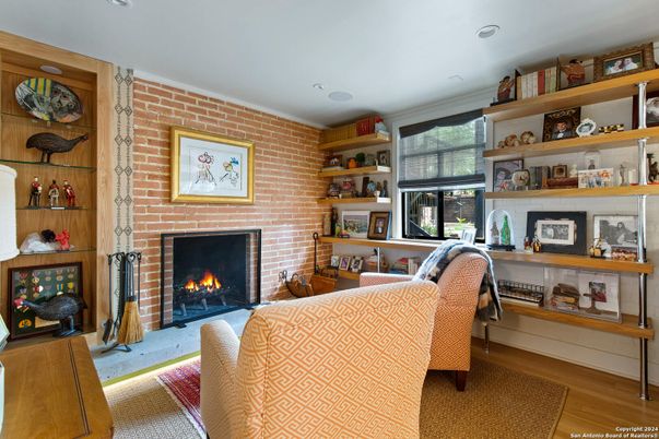 Fireplace, Interior, Living room, Recessed Lighting, Stone Walls, Wood Texture Flooring