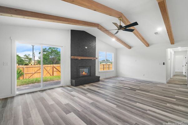 Empty room, Fireplace, Interior, Recessed Lighting, Wooden Beams, Wood Texture Flooring
