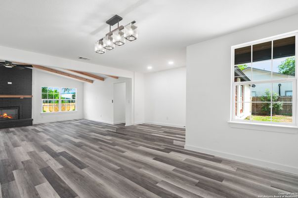 Empty room, Fireplace, Interior, Pendant Lights, Recessed Lighting, Wood Texture Flooring