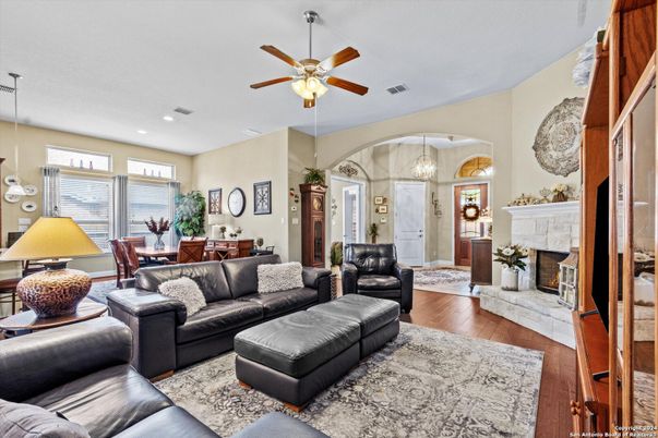 Dining room, Fireplace, Interior, Living room, Pendant Lights, Recessed Lighting, Wood Texture Flooring