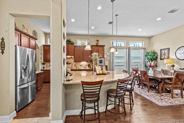 Dining room, Interior, Kitchen, Pendant Lights, Recessed Lighting, Stainless Steel Appliances, Wood Texture Flooring