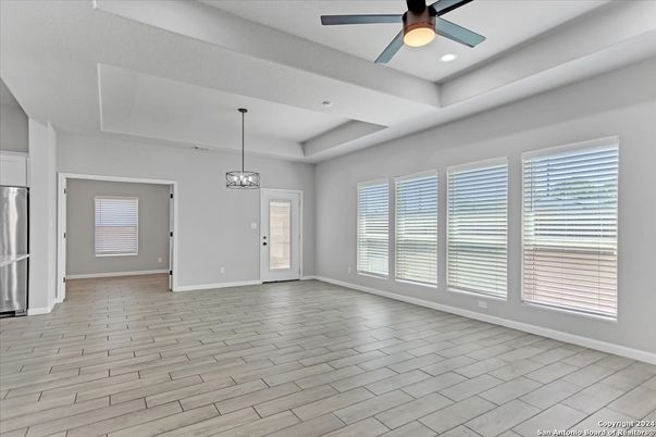 Empty room, Interior, Kitchen, Pendant Lights, Recessed Lighting, Stainless Steel Appliances, Wood Texture Flooring