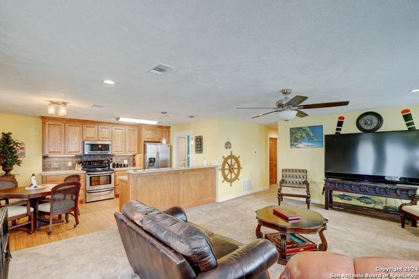 Dining room, Interior, Kitchen, Living room, Pendant Lights, Recessed Lighting, Stainless Steel Appliances, Wood Texture Flooring