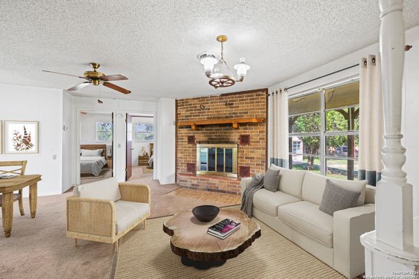 Chandelier, Fireplace, Interior, Living room, Stone Walls