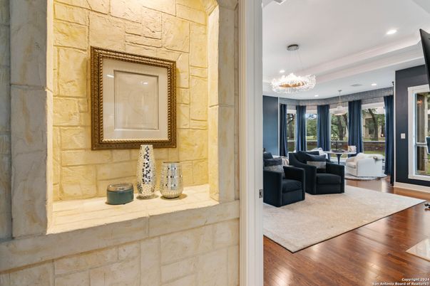 Chandelier, Interior, Living room, Pendant Lights, Recessed Lighting, Stone Walls, Wood Texture Flooring