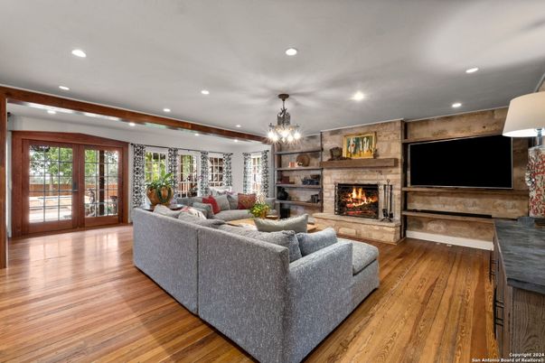 Fireplace, Interior, Living room, Recessed Lighting, Stone Walls, Wood Texture Flooring