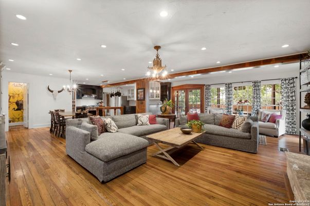 Chandelier, Dining room, Interior, Kitchen, Living room, Pendant Lights, Recessed Lighting, Stainless Steel Appliances, Wood Texture Flooring