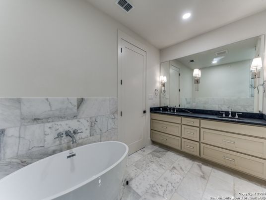 Bathroom, Dual Sink Vanities, Free Standing Baths, Interior, Marble, Marble Walls, Recessed Lighting
