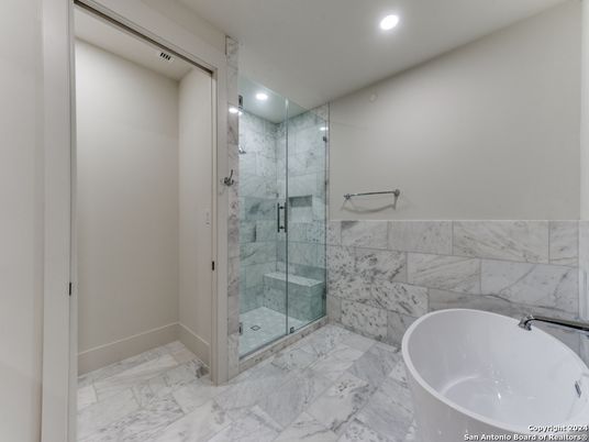 Bathroom, Free Standing Baths, Glass Shower, Interior, Marble, Marble Walls, Recessed Lighting