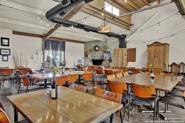 Dining room, Fireplace, Interior, Living room, Pendant Lights, Stone Walls, Wooden Beams, Wood Texture Flooring