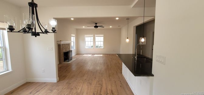 Fireplace, Interior, Pendant Lights, Recessed Lighting, Wood Texture Flooring