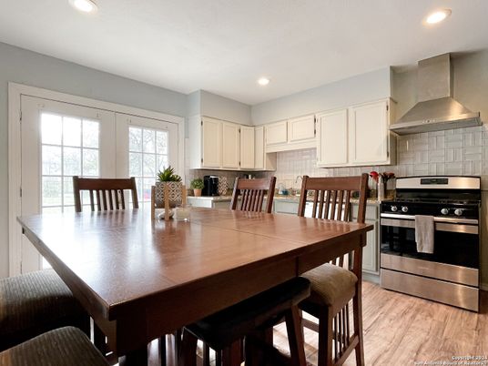 Dining room, Interior, Kitchen, Recessed Lighting, Stainless Steel Appliances, Wood Texture Flooring