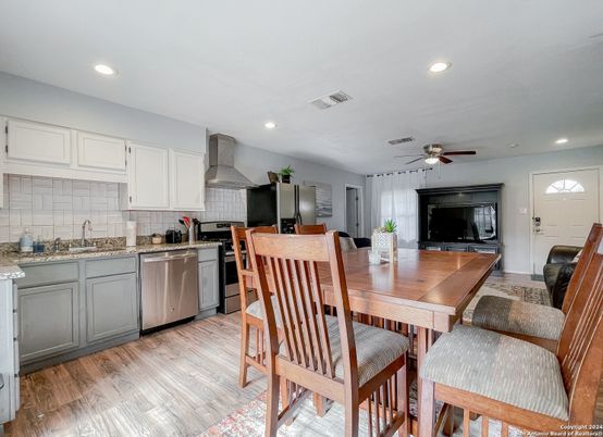Dining room, Interior, Kitchen, Recessed Lighting, Stainless Steel Appliances, Wood Texture Flooring