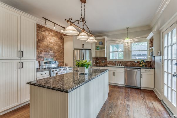Interior, Kitchen, Pendant Lights, Stainless Steel Appliances, Stone Walls, Wood Texture Flooring