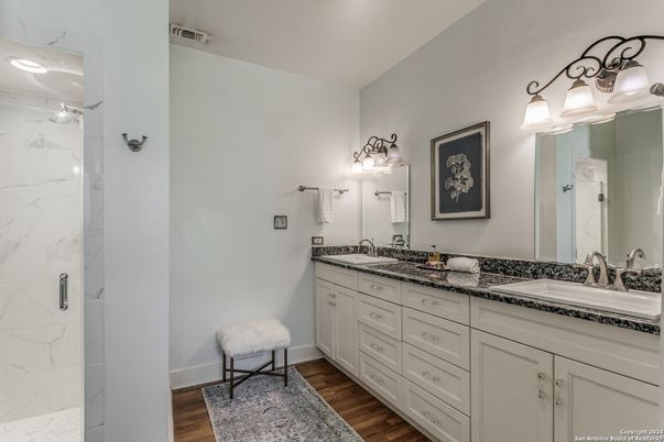 Bathroom, Dual Sink Vanities, Interior, Marble Walls, Wood Texture Flooring