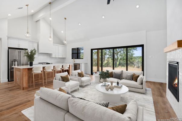 Fireplace, Interior, Kitchen, Living room, Pendant Lights, Recessed Lighting, Stainless Steel Appliances, Wood Texture Flooring