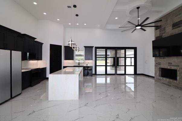 Fireplace, Interior, Kitchen, Marble, Pendant Lights, Recessed Lighting, Stone Walls
