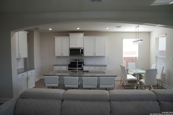 Dining room, Interior, Kitchen, Pendant Lights, Recessed Lighting, Stainless Steel Appliances, Wood Texture Flooring