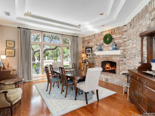 Dining room, Fireplace, Interior, Recessed Lighting, Stone Walls, Wood Texture Flooring