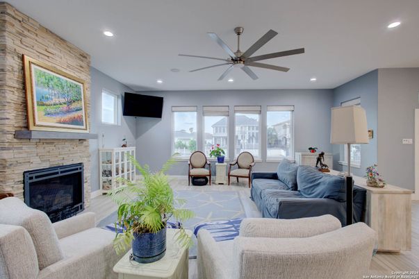 Fireplace, Interior, Living room, Recessed Lighting, Stone Walls, Wood Texture Flooring