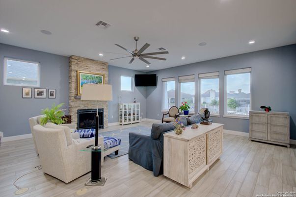 Fireplace, Interior, Living room, Recessed Lighting, Stone Walls, Wood Texture Flooring