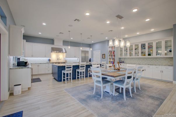 Dining room, Interior, Kitchen, Pendant Lights, Recessed Lighting, Stainless Steel Appliances, Wood Texture Flooring