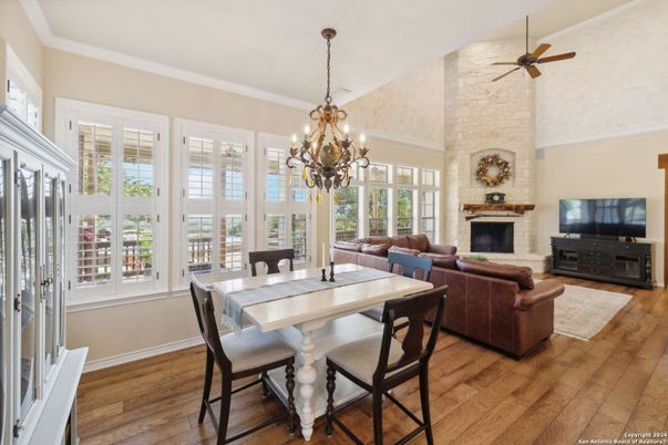 Chandelier, Dining room, Fireplace, Interior, Living room, Stone Walls, Wood Texture Flooring